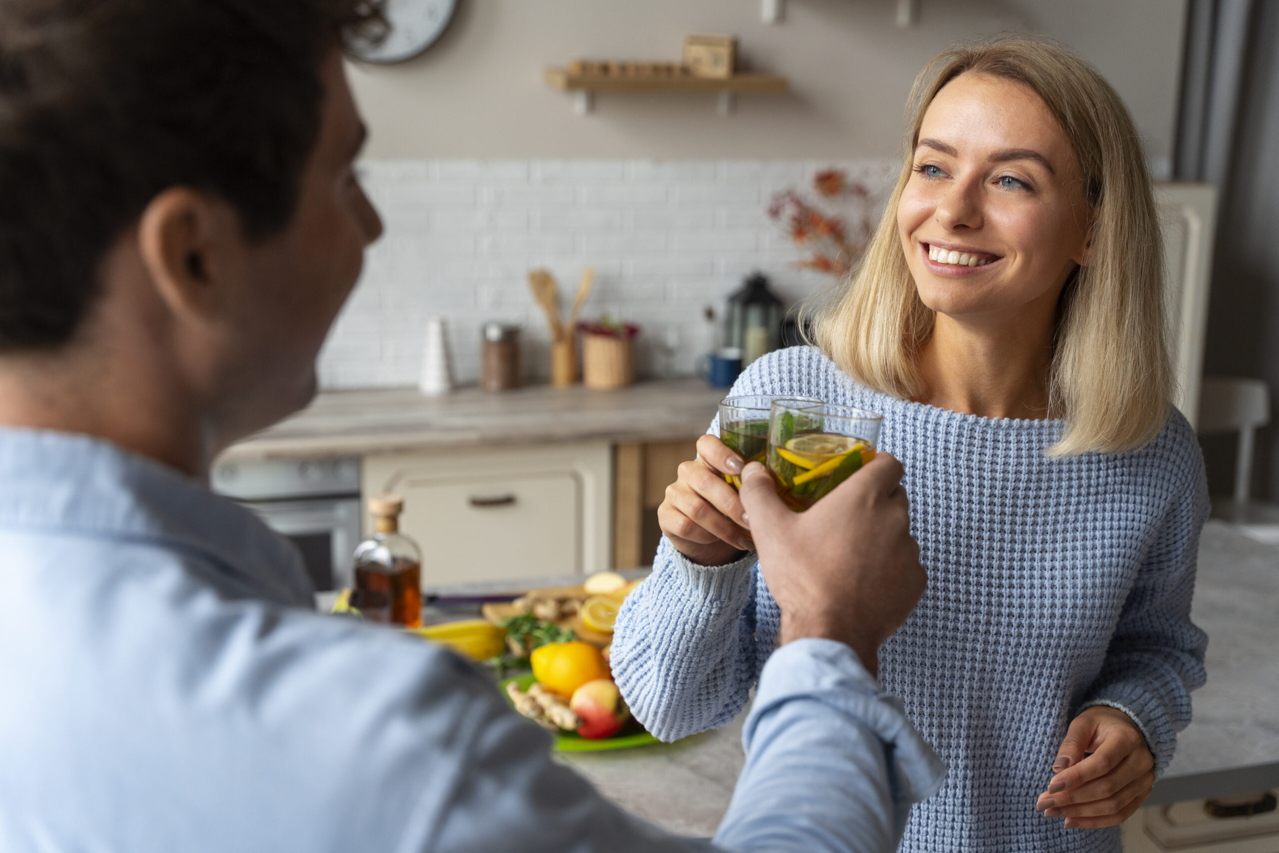 person-drinking-kombucha-home-kitchen